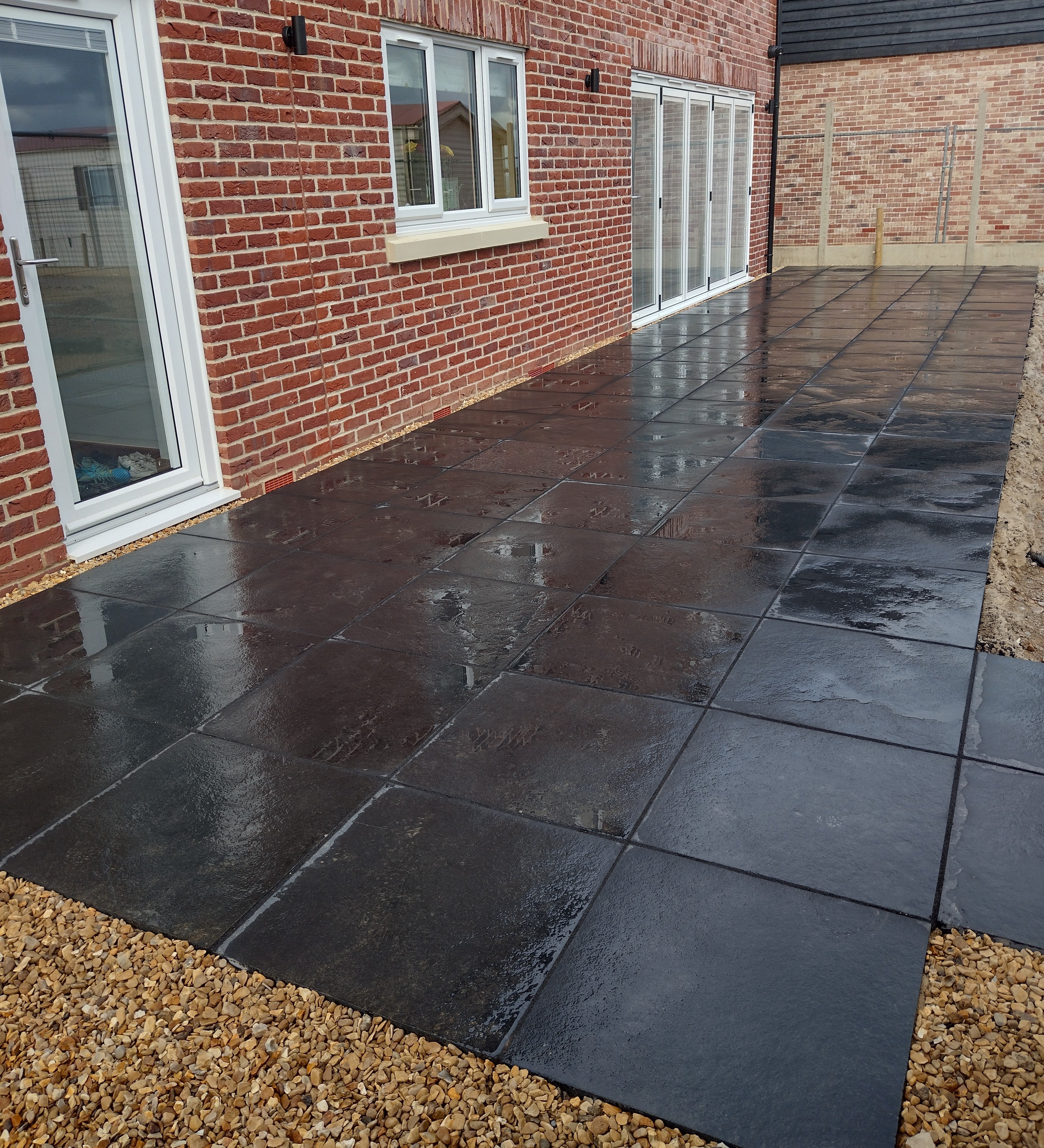 Black Natural Indian Limestone Paving Slabs - Riven - Sawn Edge - 600x600 - 22mm